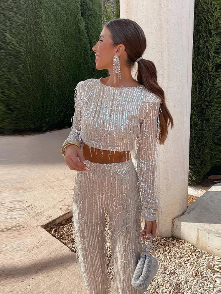 Tweedelige glitterset voor feestelijke avonden met lange mouwen top en glanzende broek