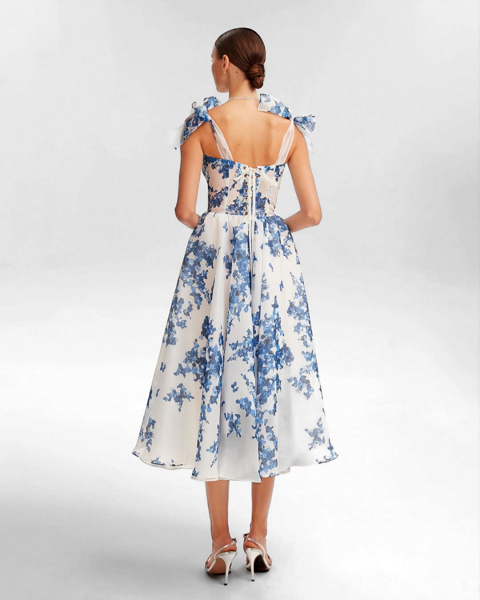 Midi zomerjurk met speelse bloemenlook en smalle bandjes