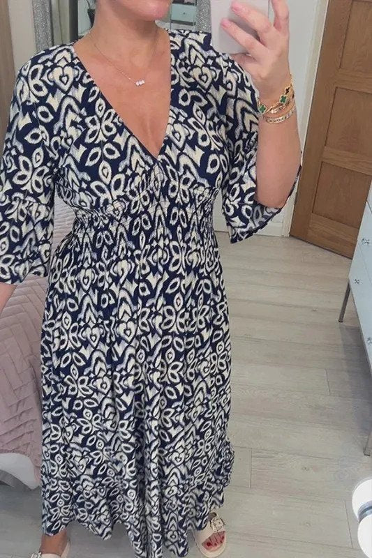 Bohemian maxi jurk met vloeiende pasvorm en halflange mouwen voor een stijlvolle look
