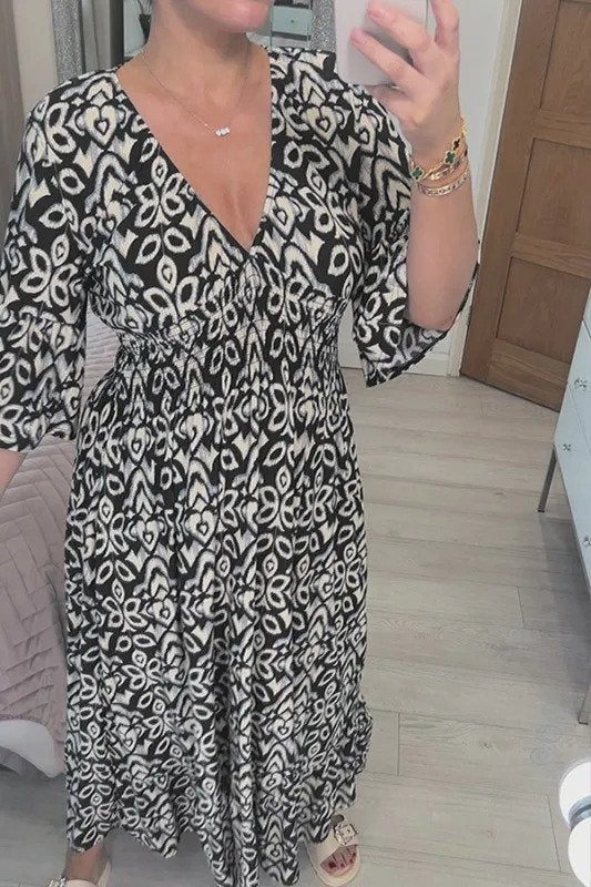 Bohemian maxi jurk met vloeiende pasvorm en halflange mouwen voor een stijlvolle look