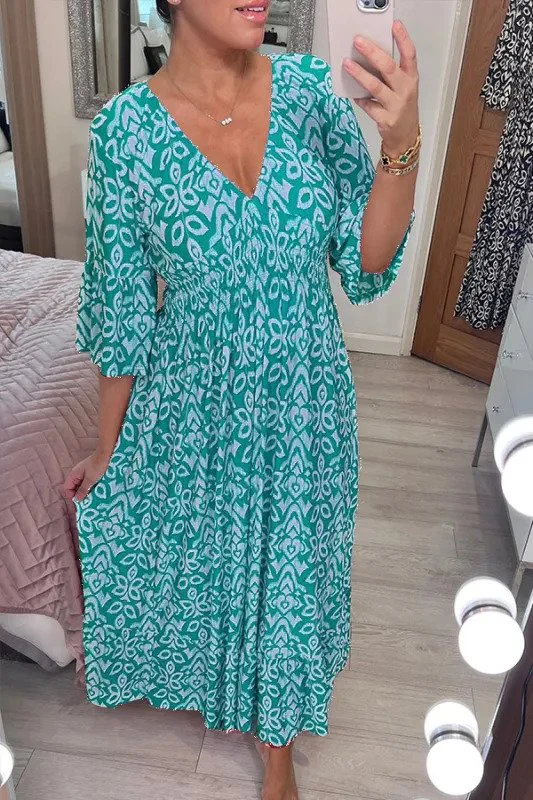 Bohemian maxi jurk met vloeiende pasvorm en halflange mouwen voor een stijlvolle look
