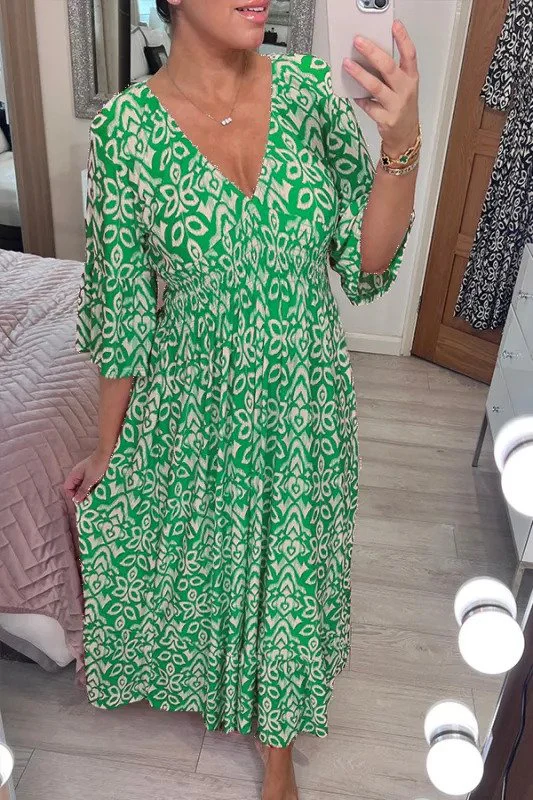 Bohemian maxi jurk met vloeiende pasvorm en halflange mouwen voor een stijlvolle look