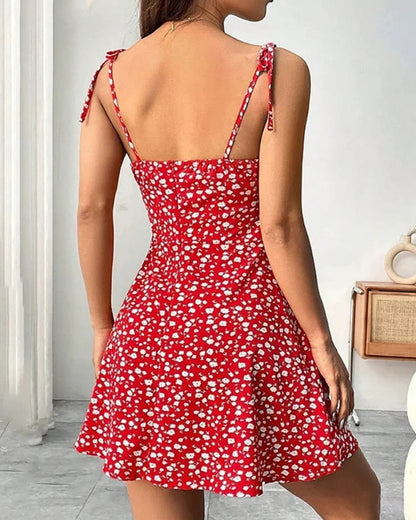 Charmante mini jurk met bloemenaccenten en smalle bandjes